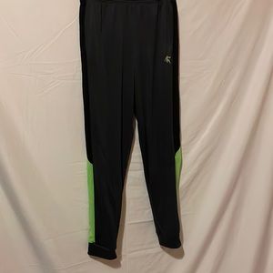 Gray jogging pants with black and green stripes on the legs.